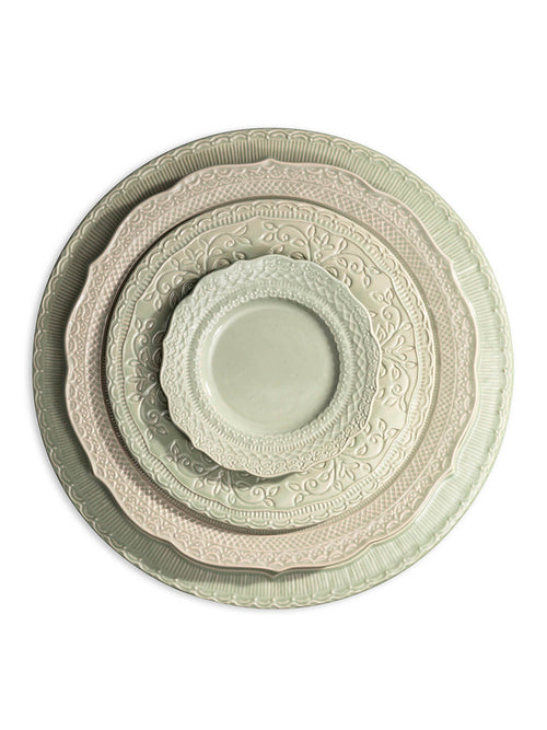 The Verdant Plate Range includes four vintage-inspired plates in assorted sizes, each with ornate embossed patterns and scalloped edges, finished in soft pastel green and beige tones.