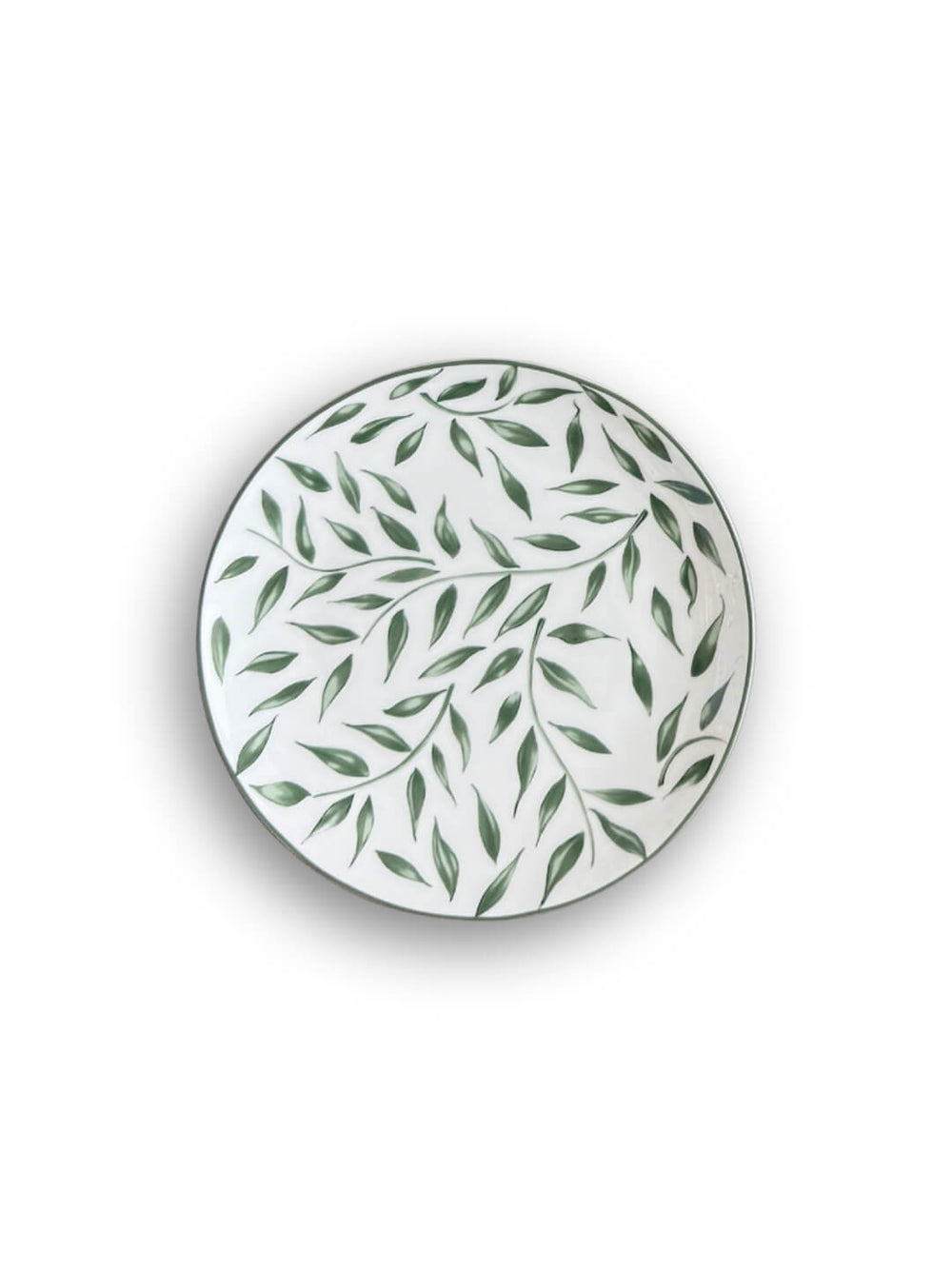 Four round white Willow Plate Range plates, each adorned with a green leaf motif, are stacked from largest to smallest and arranged concentrically on a white background, creating a fresh botanical look.