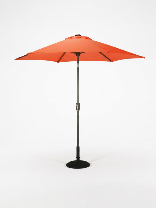 The Amalfi Parasol, a red weather-resistant model with a central pole and round black base from our Colourful Parasol Collection, stands against a plain white background—ideal for outdoor event shade.