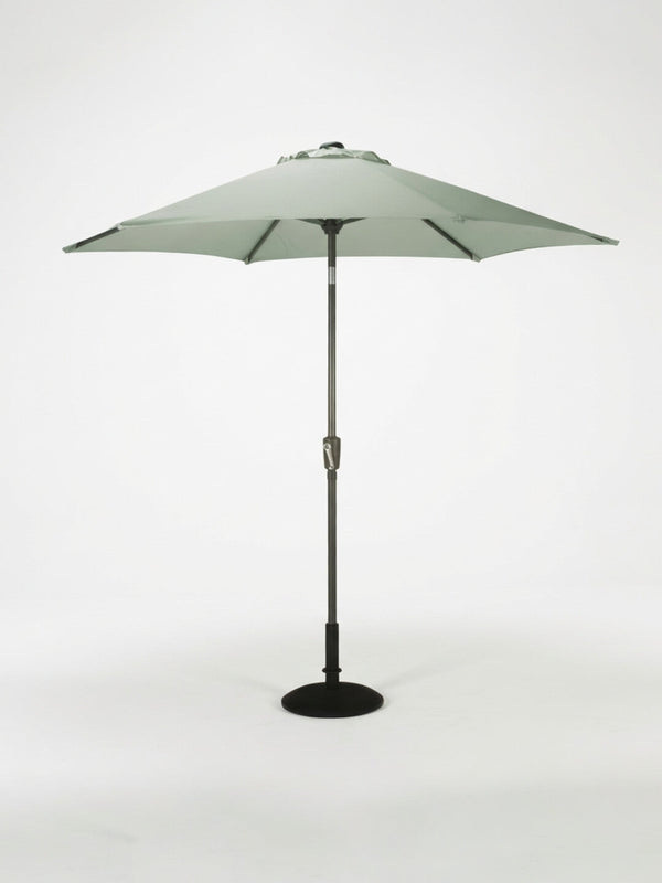 The Amalfi Parasol from the Colourful Parasol Collection is a large, light green round patio umbrella with weather-resistant design, mounted on a dark pole with black base, shown against a white background. Ideal for outdoor event shade.