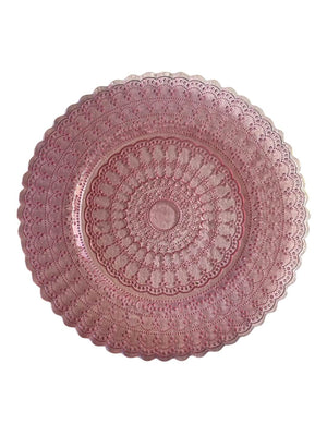The Antoinette Pink Charger Plate features a round shape, intricate lacy patterns, and scalloped edges, showcasing vintage-inspired elegance against a white background.
