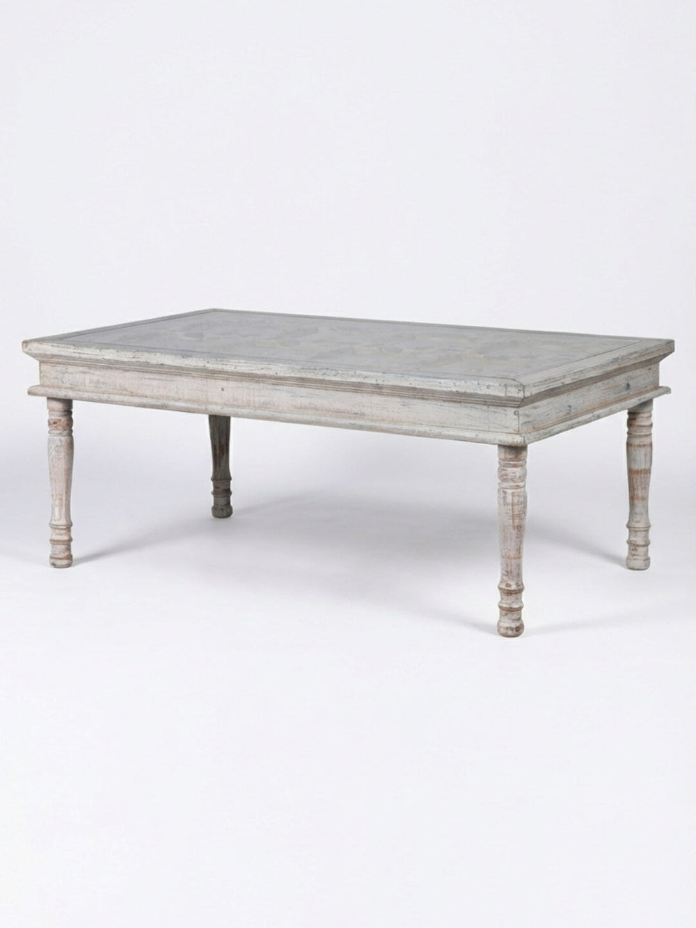 The Chantilly Coffee Table features a rectangular French country design with a distressed light gray finish and four turned legs, shown against a plain white background.