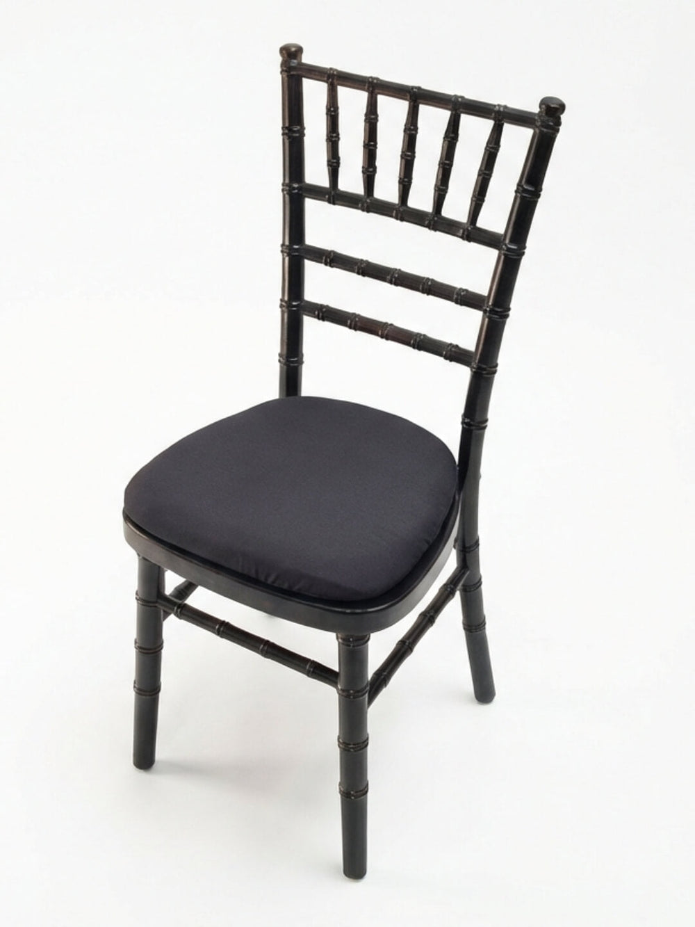 The Chiavari Chair - Black features a black wooden frame with a faux bamboo design and a cushioned black seat, offering stylish event seating. Photographed against a white background.