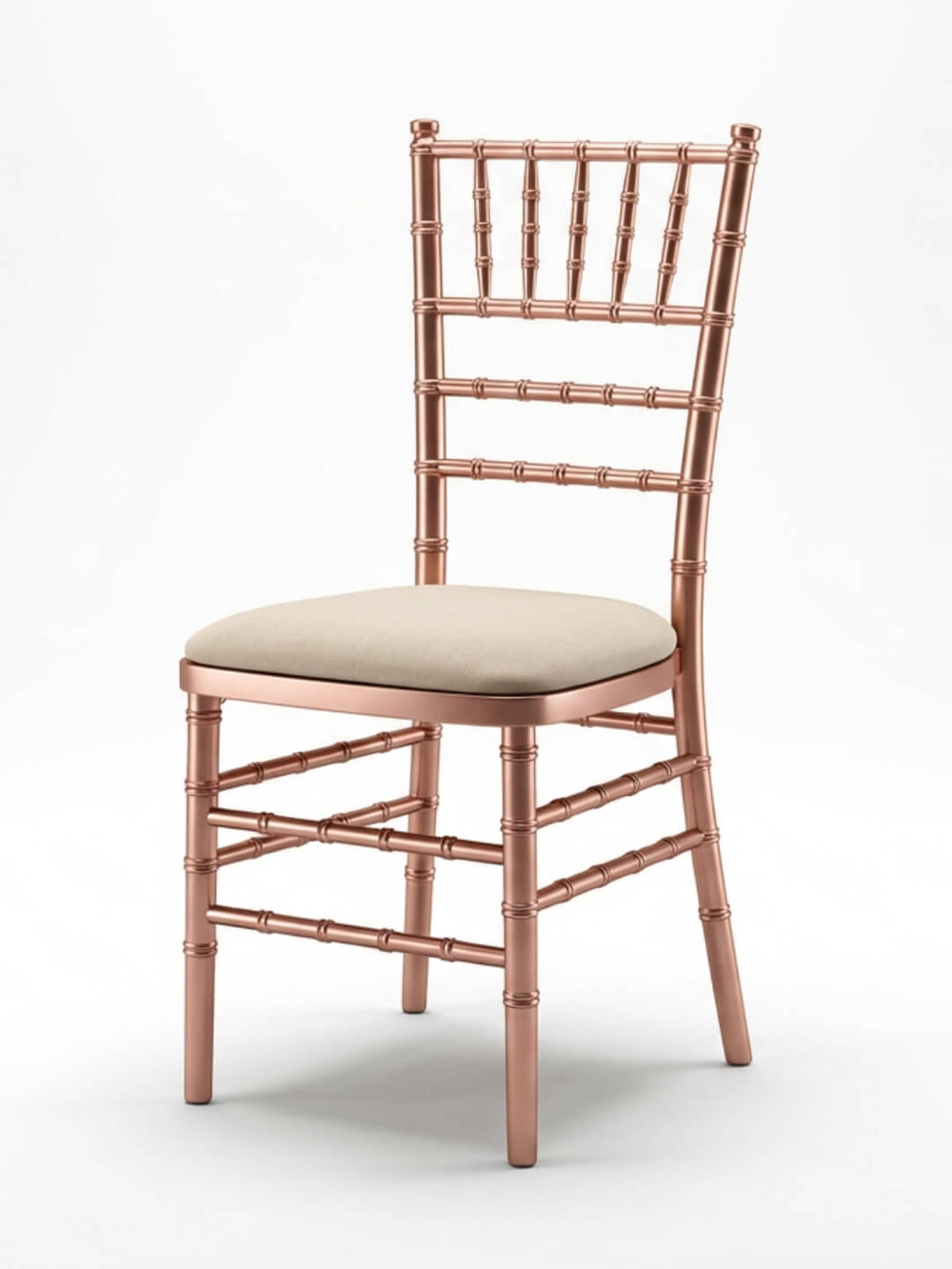 The Chiavari Chair - Rose Gold features a metallic rose gold finish, cream cushioned seat, and decorative spindle design, making it ideal for elegant events. Shown on a white background; custom seat pads available.