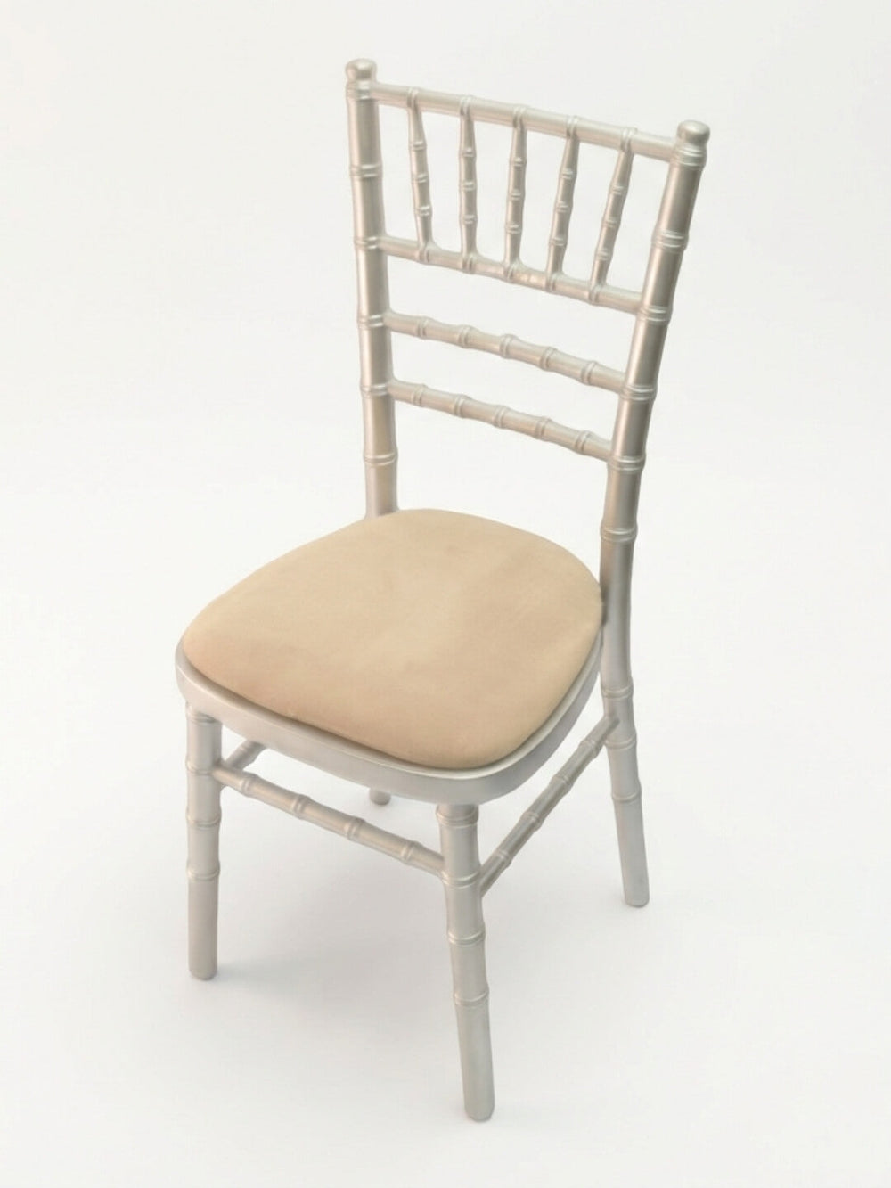 The Chiavari Chair - Silver, featuring a cushioned beige seat pad, is ideal for event seating and shown here against a plain white background.