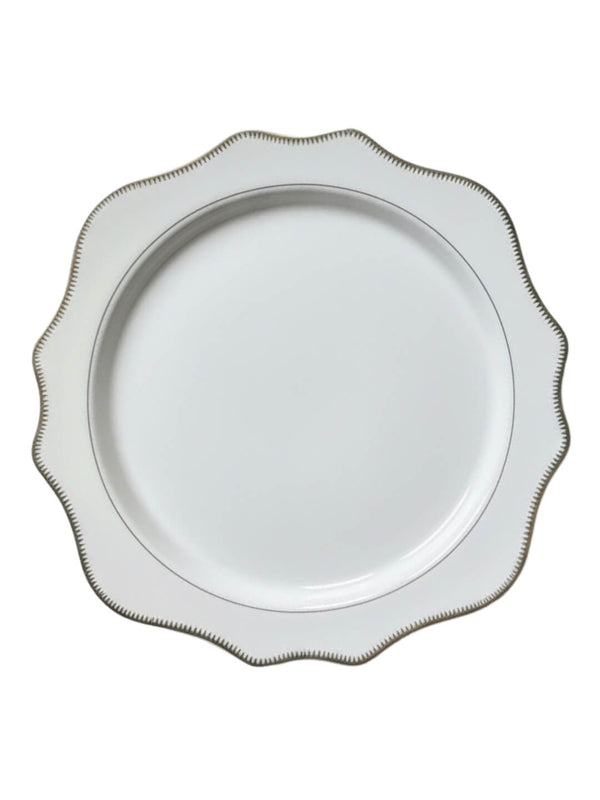 The Colette White Charger Plate features a scalloped edge and delicate gold trim, shown elegantly against a white background.