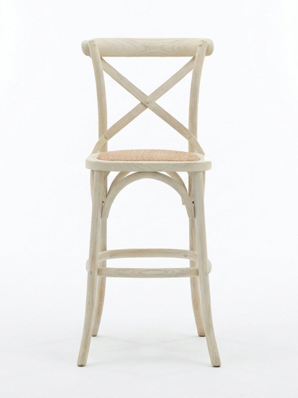 The Cross Back Bar Stool, featuring an X-shaped backrest and woven seat in a light finish, adds rustic farmhouse charm to any space. Shown against a white background.