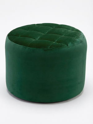 The Eden Pouffe, a round green velvet piece with a quilted and tufted top, is shown on a plain white background.