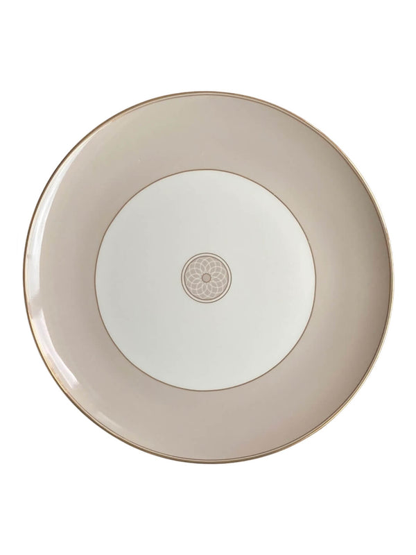 The Grace Charger Plate is a round, beige porcelain charger with a white center, gold rim, and elegant floral pattern—an ideal choice to enhance your luxury tableware collection.