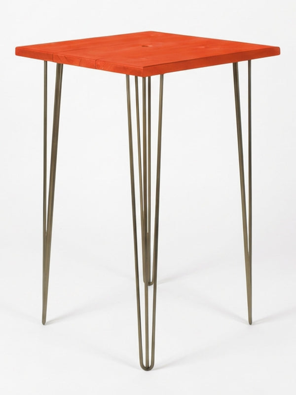 The Hairpin Bar Table Collection features a modern square red wooden top with four slim metal hairpin legs, set against a white background—ideal for adding vibrant event furniture to any setting.