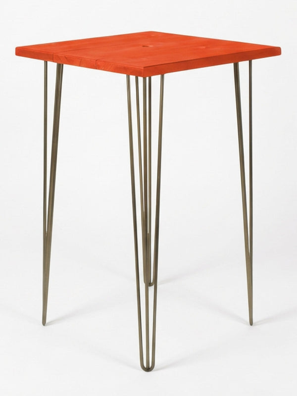 The Hairpin Bar Table Collection offers a modern bar table with a bright red square wooden top and four slender metal hairpin legs—an eye-catching choice for colourful event furniture against plain white backgrounds.