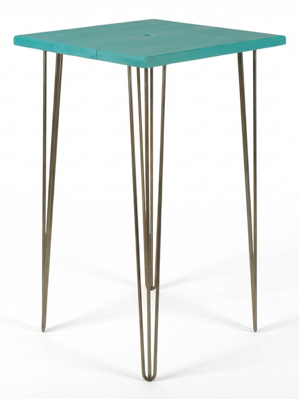 A modern bar table from the Hairpin Bar Table Collection, showcasing a vibrant square teal top and four sleek metal hairpin legs, set against a plain white background.