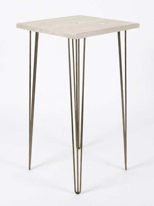 A compact square table from the Hairpin Bar Table Collection, featuring a light wood top and three sleek metallic hairpin legs against a plain white backdrop—perfect as vibrant event furniture or a chic bar table.