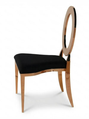 The Halo Chair is a modern event seat with a metallic gold frame, black upholstered seat, and an oval open backrest.