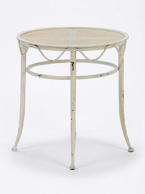 The Jardin Table is a vintage French garden table with a mesh top, three slender weathered legs, and a decorative wavy edge—ideal as charming furniture for outdoor events.