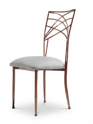 The Lattice Chair features slender legs, a geometric backrest, and a light gray cushioned seat—ideal for modern events—and is displayed against a plain white background.