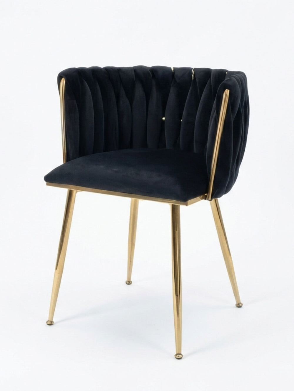 The Noir Signature Chair boasts a black tufted velvet backrest and seat, accented by slim gold metal legs and frame, all set against a plain white background—a modern luxury piece that redefines elegance.