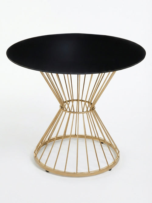 The Orbit Table showcases a sleek black glass top and an eye-catching geometric gold wire base, offering a modern touch ideal for contemporary interiors.