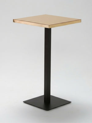 The Reflection Table Collection features a modern, minimalist side table with a square gold top and slim black metal pedestal base—perfect for event bar hire or customisable bar furniture, shown against a plain white background.