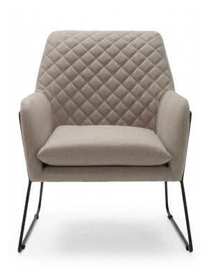 The Sandstone Chair is a modern accent chair with quilted, diamond-patterned beige linen upholstery, a wide cushioned seat, and sleek black metal legs, displayed from the front against a plain white background.