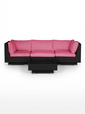 The Sereno Black is a modern modular L-shaped sofa in black, featuring bright pink cushions and pillows, paired with a matching black coffee table. This contemporary outdoor set is displayed against a plain white background.