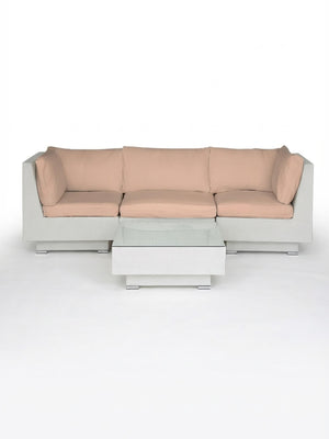 The Sereno White set includes a modern modular sofa with light beige cushions and a matching rectangular coffee table, both with white rattan frames—ideal for stylish outdoor entertaining against a plain white background.