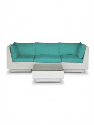 The Sereno White modular sofa, set in an L-shape with turquoise cushions, features a matching rectangular coffee table, all displayed against a plain white background.