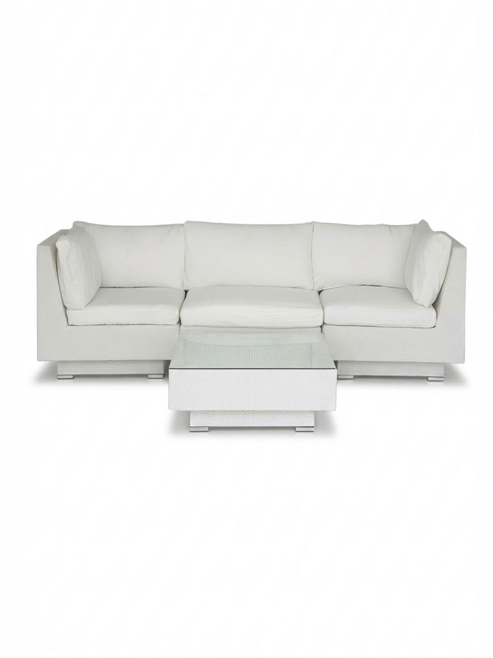 The Sereno White features a modern modular white sectional sofa with clean lines and plush cushions, plus a matching square coffee table—all set against a plain white background for stylish outdoor lounging.