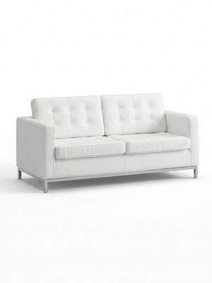 The Soho Sofa is a modern white faux leather piece with tufted back cushions, straight arms, and metal legs—ideal as stylish event furniture against a plain white background.