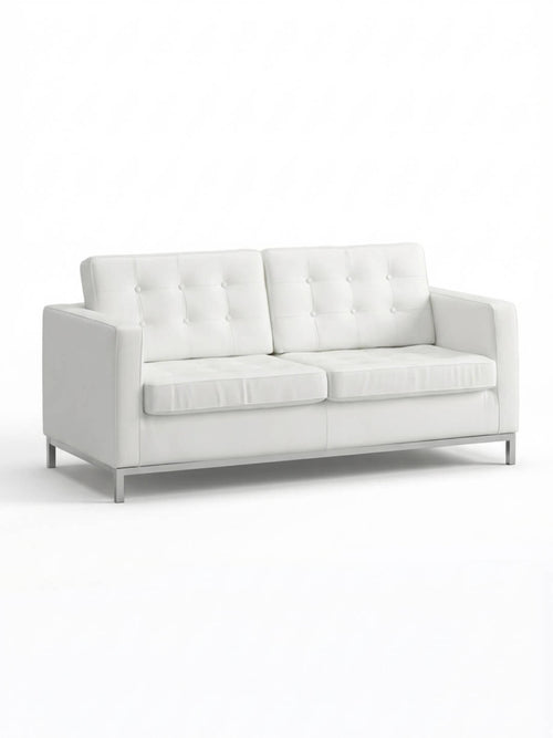The Soho Sofa is a modern white faux leather piece with tufted back cushions, straight arms, and metal legs—ideal as stylish event furniture against a plain white background.