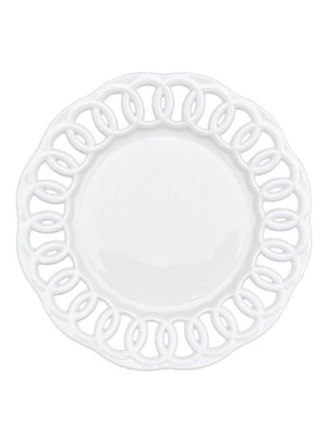The Sol Charger Plate is round and white, featuring a decorative cut-out edge with a looping, intertwined pattern that adds modern elegance.