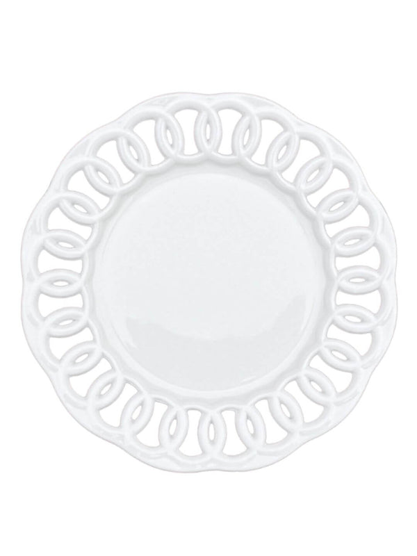 The Sol Charger Plate is round and white, featuring a decorative cut-out edge with a looping, intertwined pattern that adds modern elegance.