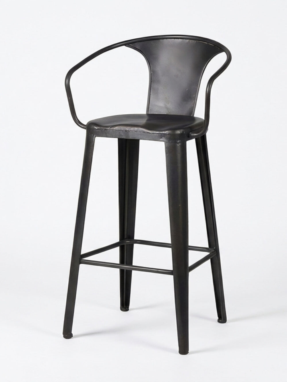 The Titan Bar Stool features a modern black metal design with a curved backrest, armrests, four straight legs, and a footrest, shown against a plain white background.