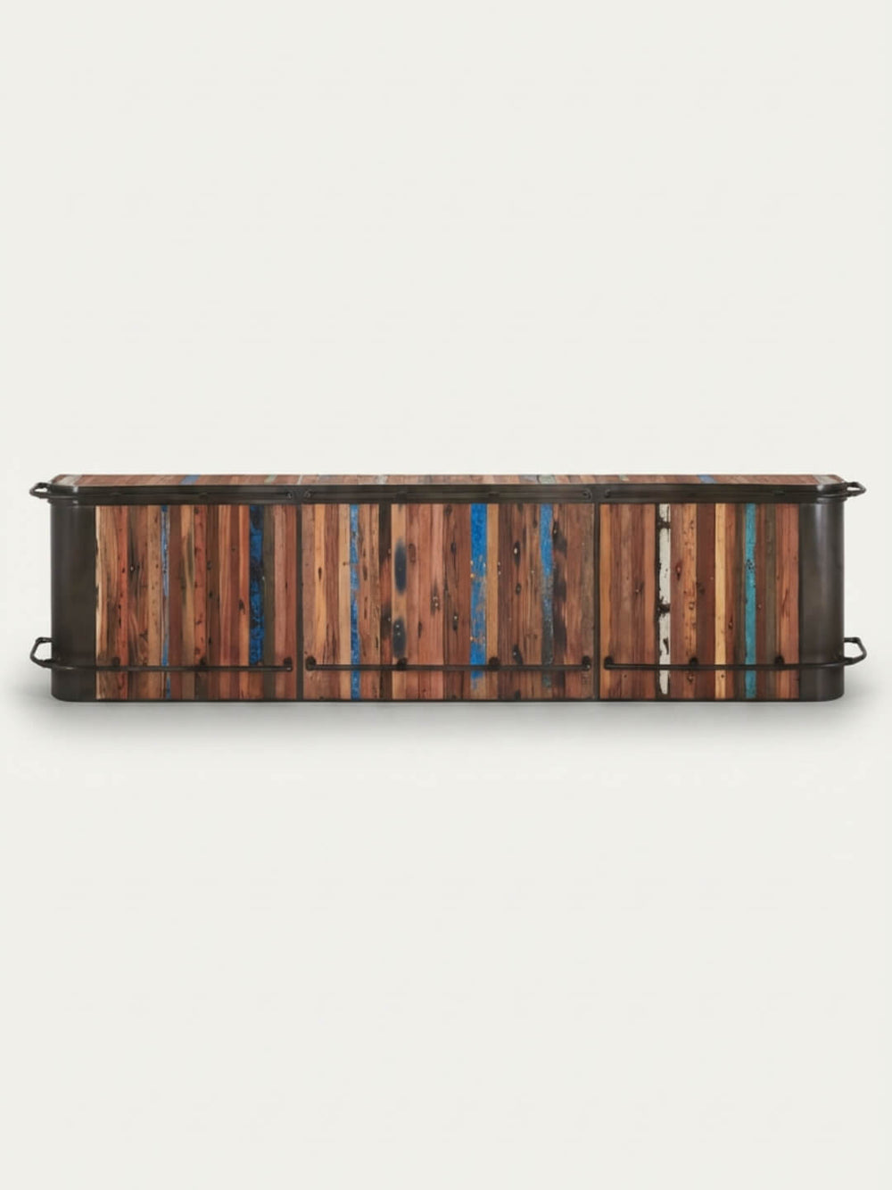 The Urban Wood Bar is a low, rectangular reclaimed wood cabinet with multicolored vertical slats in brown, blue, and teal, plus black metal handles on each side. Shown against a plain white background.