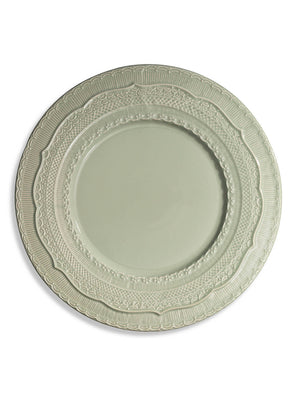 The Verdant Charger Plate is a round, light gray ceramic charger with an ornate, embossed rim featuring intricate scalloped and geometric designs. Its smooth center and elegant look make it perfect for garden weddings.