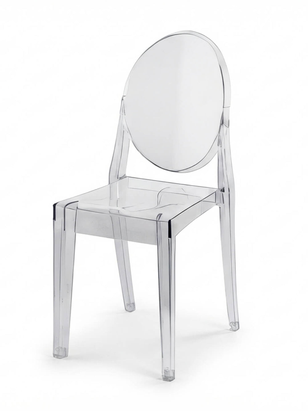The Victoria Ghost Chair features a clear, modern design with a round backrest and straight legs, crafted from transparent acrylic—ideal as stylish event furniture.