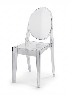 The Victoria Ghost Chair features a clear, modern design with a round backrest and straight legs, crafted from transparent acrylic—ideal as stylish event furniture.