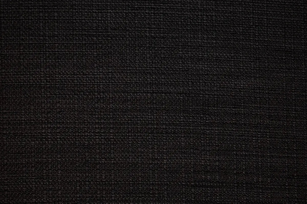A Black table linen with a smooth refined texture that enhances tables with timeless elegance.