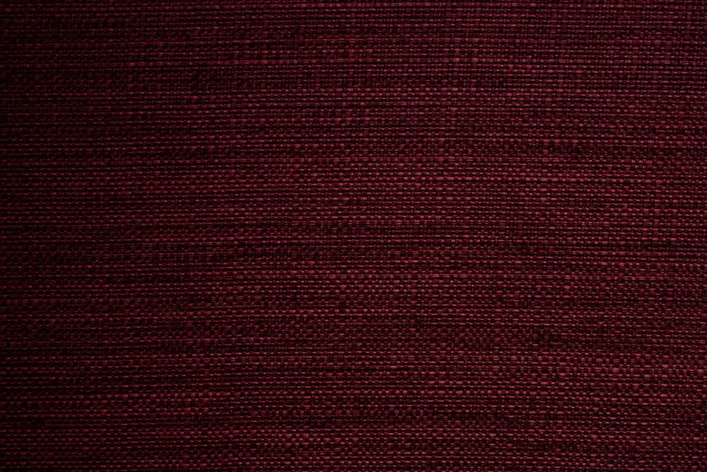 A Burgundy table linen with a smooth refined texture that enhances tables with timeless elegance.