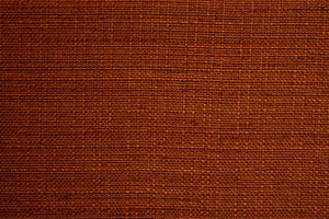 A Orange table linen with a smooth refined texture that enhances tables with timeless elegance.