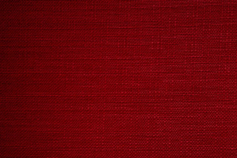 A Red table linen with a smooth refined texture that enhances tables with timeless elegance.