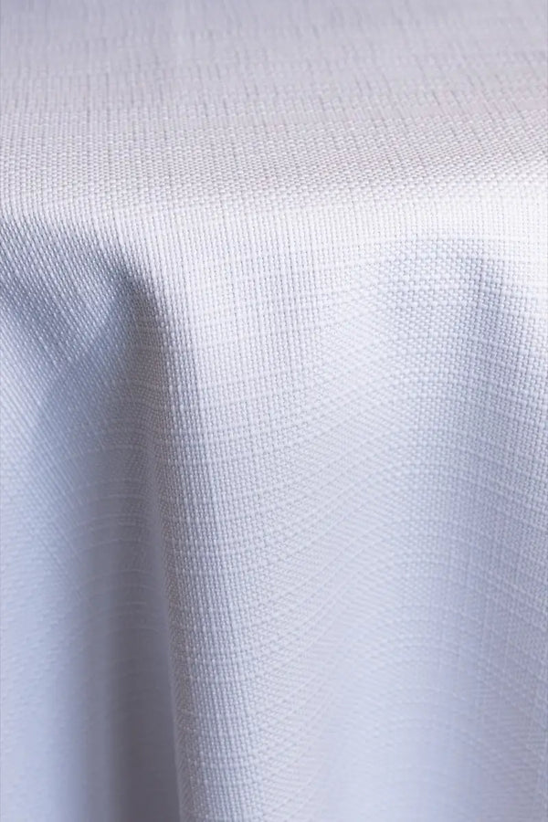 A White table linen with a smooth refined texture that enhances tables with timeless elegance.