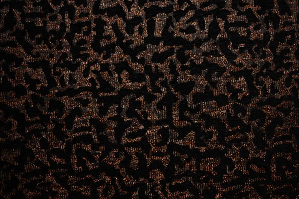 Table linen with intricate textures with subtle metallic accents bring bold style and luxurious charm to tablescapes.