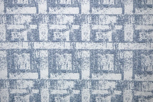 Table linen with textured geometric elegance in soft tones, bringing modern sophistication to refined table settings.