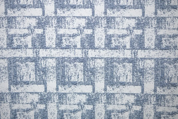 Table linen with textured geometric elegance in soft tones, bringing modern sophistication to refined table settings.
