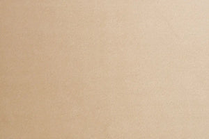 A Beige table linen with a luxurious texture that offers timeless elegance.