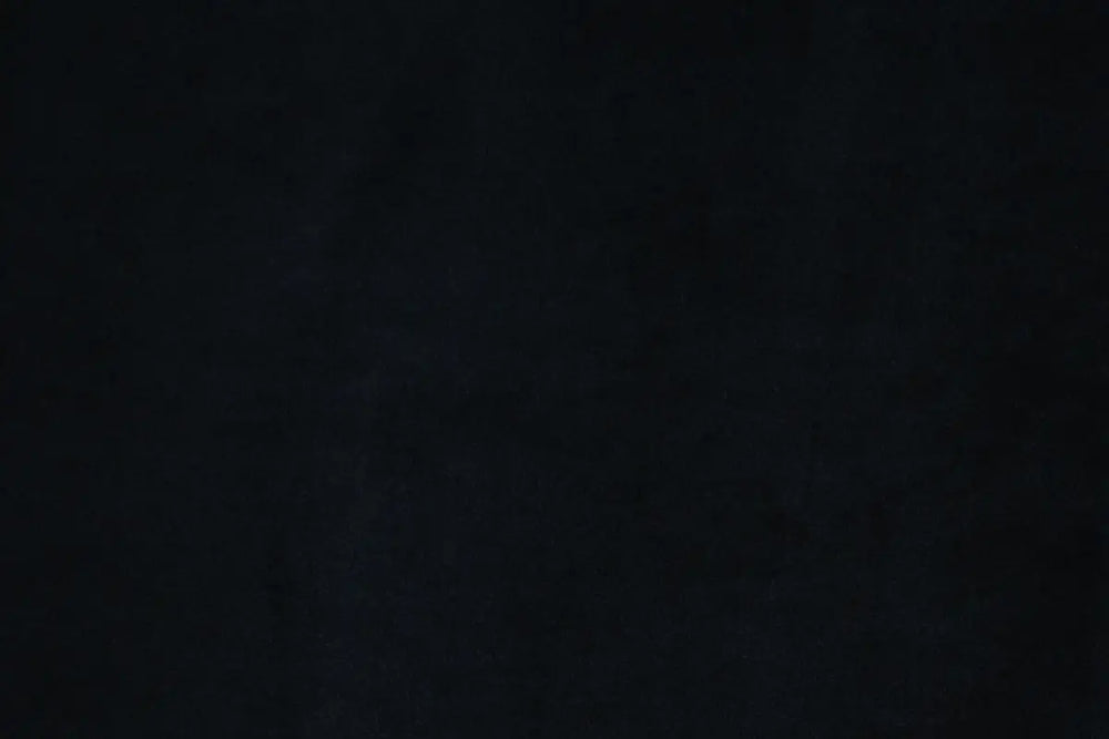 A Black table linen with a luxurious texture that offers timeless elegance.