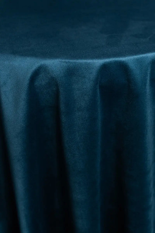 A Blue table linen with a luxurious texture that offers timeless elegance.