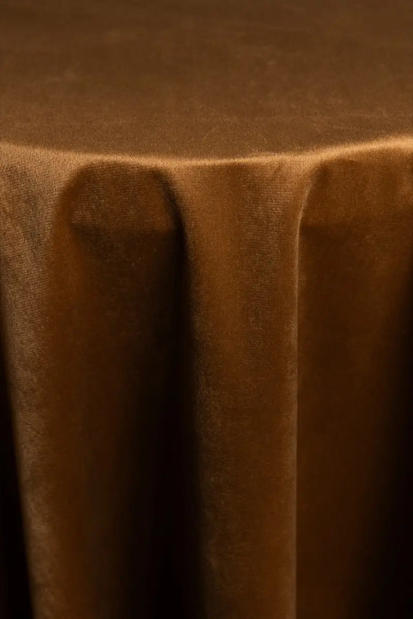 A Chocolate table linen with a luxurious texture that offers timeless elegance.