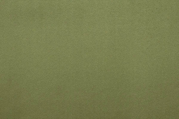 A Green table linen with a luxurious texture that offers timeless elegance.